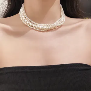 Close-up view of an elegant multi-strand French style pearl choker necklace on a model.