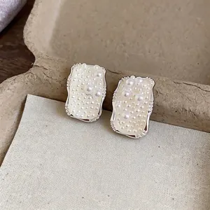 Elegant French style silver needle square pearl stud earrings with luxury niche design