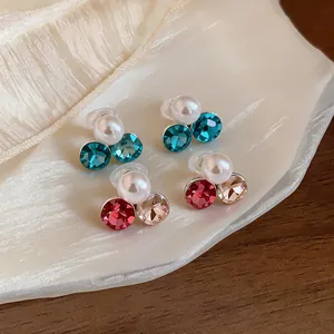 Detailed view of elegant faux pearl and faceted rhinestone non-pierced clip-on earrings