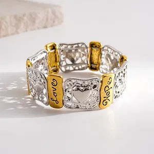 Detailed shot of retro gold and silver elastic bracelet with Love and Hope engravings