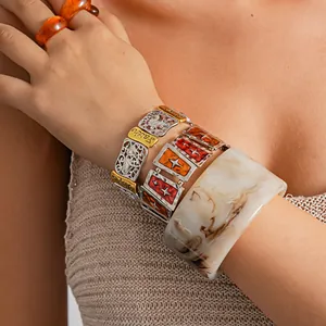 Close-up of retro stacked bracelets with Faith, Hope, Love engraving for women jewelry