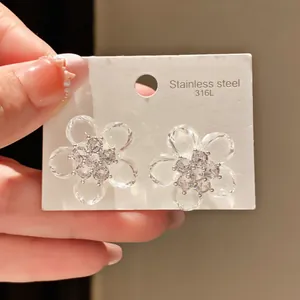 Close-up detail of vintage crystal flower earrings with sparkling zircon centers