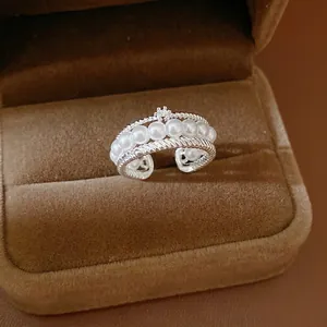 Elegant multi-layer silver open ring with white pearls and sparkling zircon flower detail