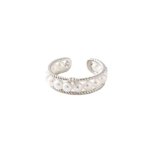 Elegant double-layered twisted silver ring featuring a row of lustrous white pearls