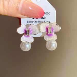 Elegant flower earrings with purple glitter enamel petals and shiny white pearl drops