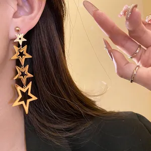Elegant golden stainless steel star tassel earrings with minimalist dangle design