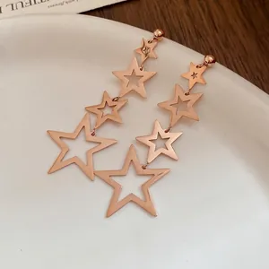 Elegant rose gold stainless steel earrings with tiered hollow star tassel design.