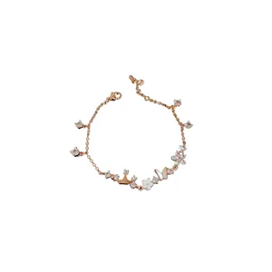 Elegant rose gold bracelet featuring zircon flowers, butterfly and crown charms