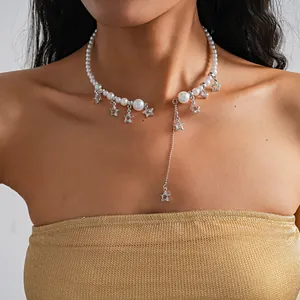 Detailed view of a stylish pearl choker necklace with dangling silver star charms and tassels