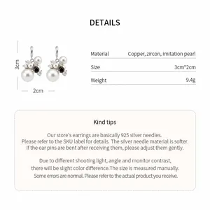 Detail view showing firework-shaped zircon and pearl earring dimensions and materials.