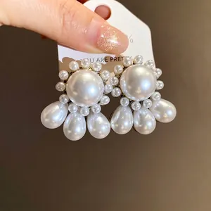 French vintage style pearl drop earrings with round and teardrop pearl accents