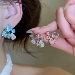 Detailed view of elegant waterdrop and geometric cubic zirconia stud earrings