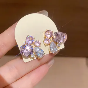 Close-up of shimmering lavender zircon teardrop earrings with elegant geometric cut