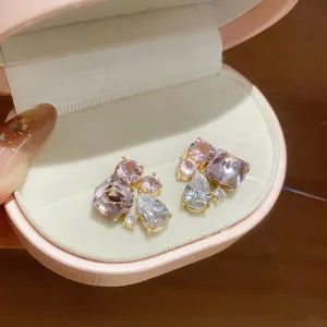 Close-up view of elegant geometric waterdrop cubic zirconia earrings in a pink gift box.