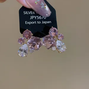 Elegant pink and clear zircon earrings with geometric teardrop design in 925 silver.