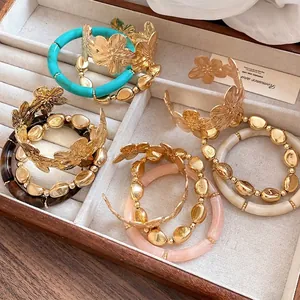 3-piece metal flower cuff and beaded bracelet set in elegant gold and turquoise finish