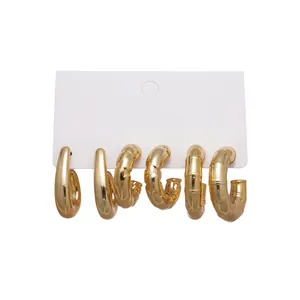 6-piece set of gold chunky C-shaped geometric hoop earrings on white display card