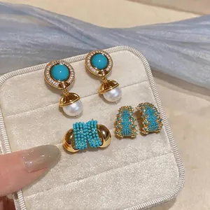 Vintage style geometric zircon and turquoise earrings set with elegant pearl drop detail