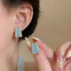 Vintage style geometric zircon stud earrings with light blue beads and gold plating
