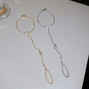 Elegant gold and silver finger bracelets with sparkling oval zircon motifs