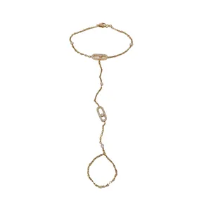 Elegant gold-tone zircon oval finger bracelet hand chain on a plain white background.