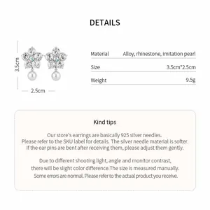 Detail view of flower stud earrings with rhinestones, pearls and dimensions