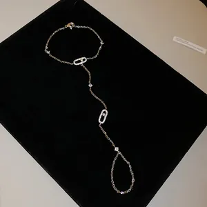 Detailed view of elegant cubic zirconia hand chain with oval sliding stone design