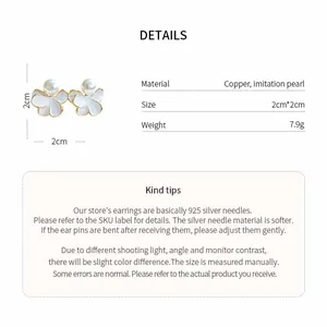 Detail view of 18k gold plated flower pearl earrings with 2cm dimensions and specs