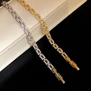 Elegant 14k gold plated CZ linked bracelet with watch-style clasp shown in two finishes