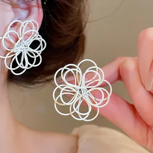 Korean style white painted flower stud earrings with twisted line design