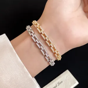 Close-up of gold and silver plated link bracelets with sparkling pavé zircons