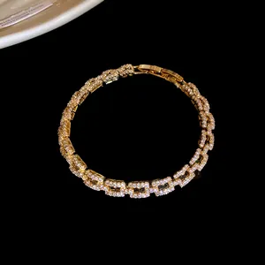 Detailed view of a 14k gold-plated bracelet with pavé-set zirconia links.