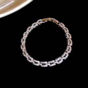 Close-up of a luxurious 14k gold-plated link bracelet with sparkling cubic zirconia