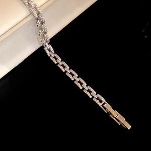 Detail shot of a silver-toned zircon bracelet featuring a sturdy fold-over clasp mechanism.