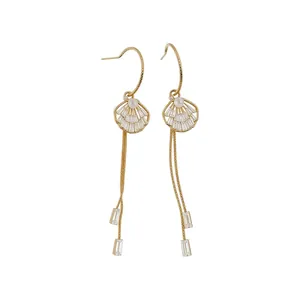 Elegant Korean style gold long tassel earrings with shell design, crystals and pearl details