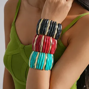 Trendy chunky acrylic stretch bracelet featuring geometric marbled design and gold metallic accents