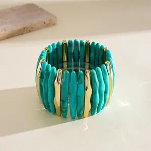 Close-up of turquoise marbled acrylic stretch bracelet with gold-tone accents.