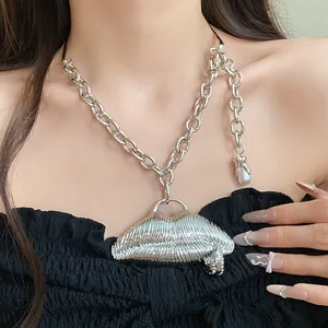 Macro view of silver lip pendant necklace featuring unique textured ridges and rhinestones
