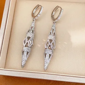 Elegant silver-tone hollow rhombus drop earrings with pavé stones inside a jewelry box gift