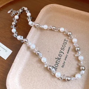 Detailed view of French style beaded necklace with pearls, crystals, and silver spheres