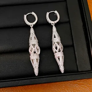 Detailed view of elegant silver hollow rhombus dangle earrings with clear stones