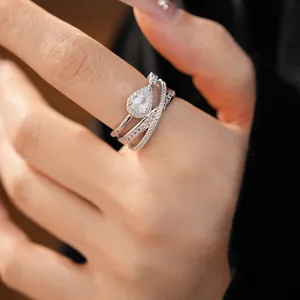 Close-up of elegant V-shaped flower ring with sparkling pear-shaped zircon inlay