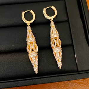 Detailed view of elegant gold-plated hollow rhombic drop earrings with paved stones