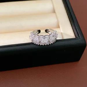 Detailed macro view of an elegant silver-toned ring with sparkling clear zircons.