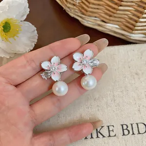 Elegant 18K gold plated cherry blossom stud earrings with pearl and zircon detail
