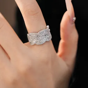 Close-up view of a vintage-style braided silver ring intricately set with sparkling cubic zirconia.