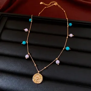 Elegant 18K gold plated necklace with pearls, turquoise beads and a coin pendant charm