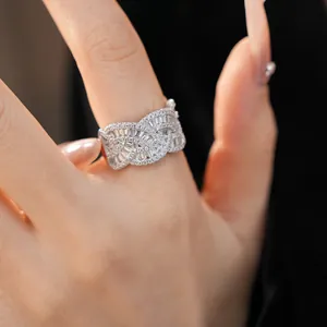Macro detail of elegant silver woven ring with sparkling baguette and round zircon stones