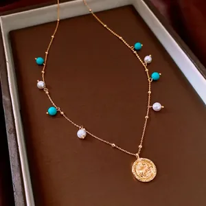 Elegant 18K gold plated necklace featuring turquoise beads and a vintage coin pendant
