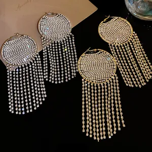 Close-up of sparkling rhinestone hoop earrings with long elegant tassels